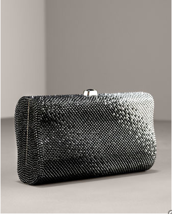 Minaudiere: a small evening bag embezzled with pieces of metal, semi precious stones or beads or covered with fabric or leather.